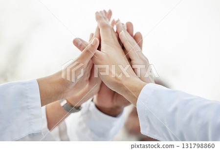 Hands, doctors and group high five in closeup for motivation, success or team building in hospital. Doctor, teamwork and hand gesture for solidarity, support or collaboration for healthcare in clinic 131798860