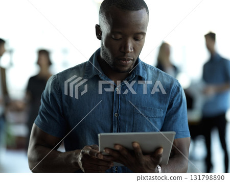 Technology, business and black man with tablet reading email, sales or social media on web. Research, internet and company ceo networking with online communication in management at startup office 131798890