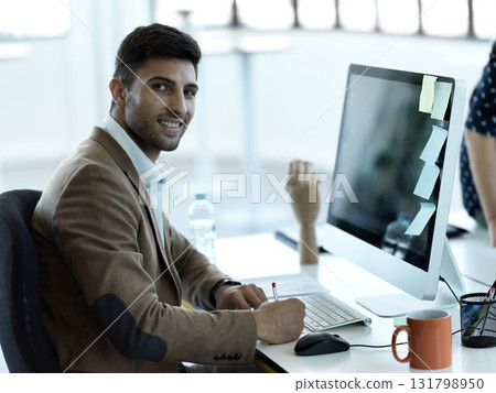 Writing, smile and face of businessman at computer in office for web design, analytics and planning. Schedule, technology and internet with employee in digital agency for idea, advertising and agenda 131798950