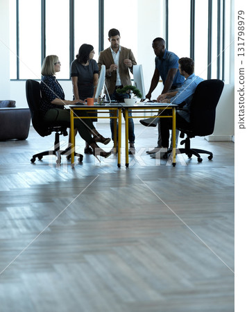 Business people, meeting and coach training staff in corporate office, boardroom or conference table. Group of employee workers in planning, coaching or teamwork strategy for company goal in workshop 131798979