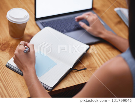 Hands, woman and writing in notebook at desk with laptop, business schedule and office administration. Closeup worker planning books of research, ideas and agenda at table, logistics or tech strategy Hands, woman and writing in notebook at desk with laptop, business schedule and office administration. Closeup worker planning books of research, ideas and agenda at table, logistics or tech strategy 131799045