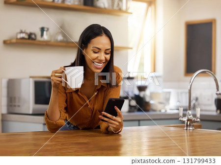 Smile, kitchen and woman with phone, coffee and relax while browsing internet, checking social media or reading email. Chat, connect and work from home lifestyle, female on tea break in apartment. Smile, kitchen and woman with phone, coffee and relax while browsing internet, checking social media or reading email. Chat, connect and work from home lifestyle, female on tea break in apartment. 131799433