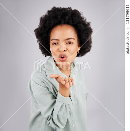 Portrait, woman and blowing kiss in studio, white background and backdrop of love, care or flirt. Face of happy female model, hands and kissing emoji for romance, happiness or smile on valentines day Portrait, woman and blowing kiss in studio, white background and backdrop of love, care or flirt. Face of happy female model, hands and kissing emoji for romance, happiness or smile on valentines day 131799611
