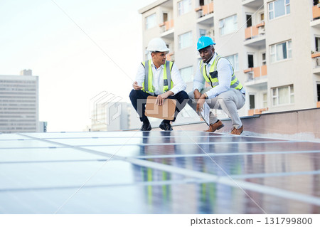 Solar panels, engineering people and rooftop inspection of energy saving, urban development or electricity. Teamwork, checklist and technician men with sustainable power solution or city installation Solar panels, engineering people and rooftop inspection of energy saving, urban development or electricity. Teamwork, checklist and technician men with sustainable power solution or city installation 131799800
