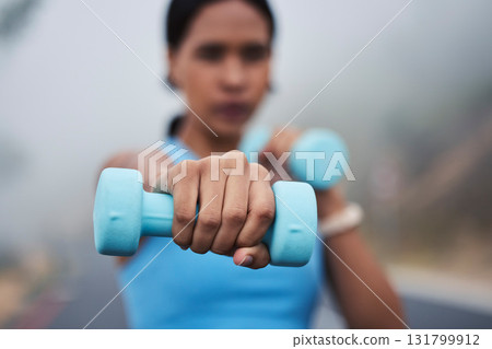Woman, hand with weightlifting and fitness, dumbbell and closeup with muscle training outdoor in street. Exercise, strong female and fist, healthy and active lifestyle with weights and wellness Woman, hand with weightlifting and fitness, dumbbell and closeup with muscle training outdoor in street. Exercise, strong female and fist, healthy and active lifestyle with weights and wellness 131799912