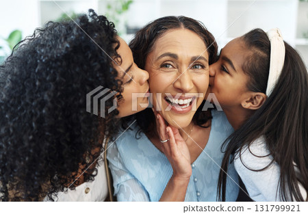 Portrait, cheek kiss and grandmother with family, daughter and granddaughter at home together. Face, love and care of happy mother, senior woman and kid kissing, bonding and laughing on mothers day. 131799921