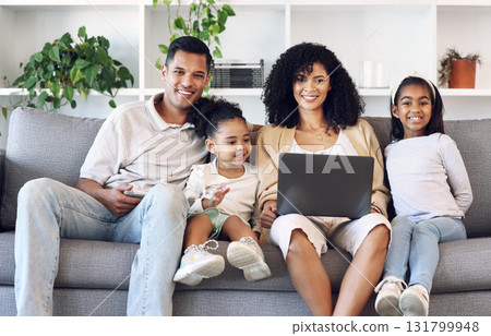 Family, home and laptop for portrait on couch while online for education, learning or movie. Mother, father and girl children together in lounge with internet for games, quality time and development 131799948