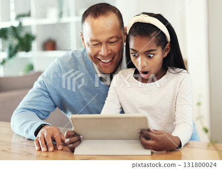 Digital tablet, shock and girl with her father streaming a movie or video online for entertainment. Surprise, technology and child watching a film or show with her dad on mobile device at their home. 131800024