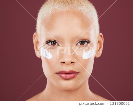 Skincare, beauty and portrait of woman with lotion on face, cosmetics and skin product on studio background. Dermatology, facial treatment and model isolated with mock up, anti ageing care and glow 131800061