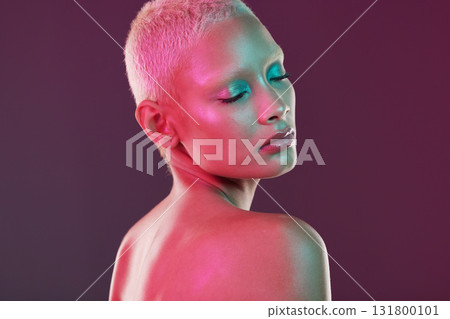 Skincare, cosmetics and woman with neon makeup and lights for creative advertising on studio background. Cyberpunk, product placement and model isolated for and futuristic beauty and art mockup space 131800101