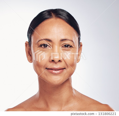 Happy, skincare and portrait of a mature woman isolated on a white background in a studio. Anti aging, beauty and the face of a model with a smile for dermatology, skin glow and care in retirement 131800221