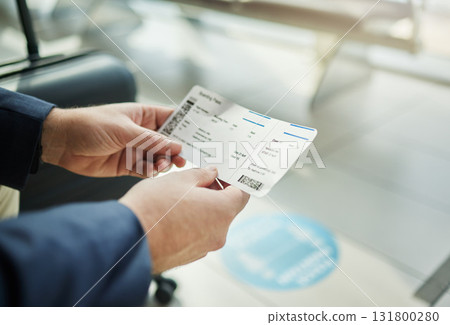 Plane ticket in hands, travel and person at airport, waiting on flight for business trip, check in and boarding. Closeup, .professional conference or convention with travelling for work and journey Plane ticket in hands, travel and person at airport, waiting on flight for business trip, check in and boarding. Closeup, .professional conference or convention with travelling for work and journey 131800280