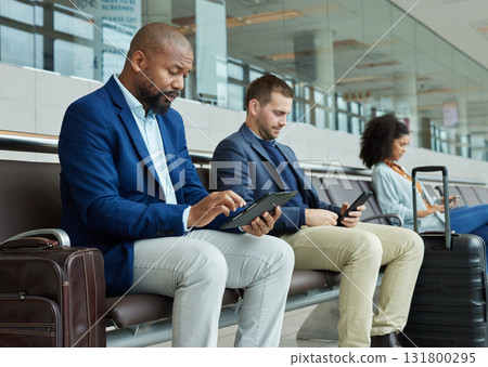 Lobby, airport and people on technology for online flight booking, information or travel schedule. Digital app, news and business black man on tablet for immigration, international or job opportunity 131800295