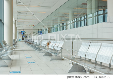 Empty airport, terminal lounge and chair furniture in waiting room of departure, global travel or transportation. Airplane lobby, seat and space of commercial flight, building interior or backgrounds Empty airport, terminal lounge and chair furniture in waiting room of departure, global travel or transportation. Airplane lobby, seat and space of commercial flight, building interior or backgrounds 131800309