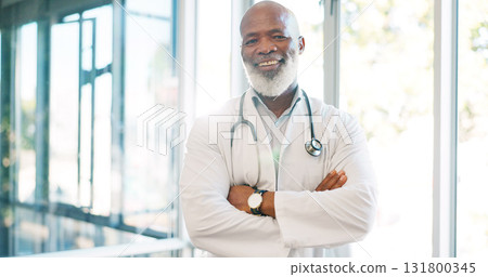 Senior doctor in portrait, black man with arms crossed and health, happy with confidence at hospital with pride and healthcare. Medical professional, trust or expert at clinic with pride and medicine Senior doctor in portrait, black man with arms crossed and health, happy with confidence at hospital with pride and healthcare. Medical professional, trust or expert at clinic with pride and medicine 131800345
