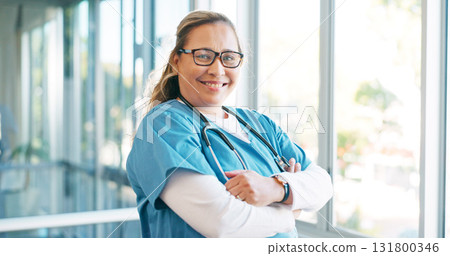 Nurse in portrait, woman with arms crossed and health, smile with confidence at hospital with pride and help. Medical professional, trust and expert caregiver at clinic with scrubs and medicine 131800346