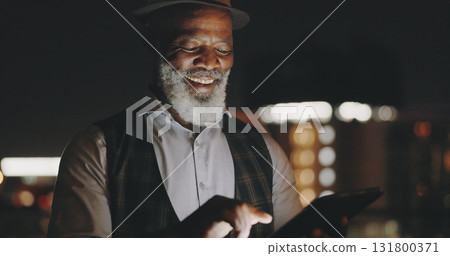 Working, tablet and mature business man with tablet on city roof at night on break with social media. Ceo and smile of African entrepreneur with professional work and company with reading article Working, tablet and mature business man with tablet on city roof at night on break with social media. Ceo and smile of African entrepreneur with professional work and company with reading article 131800371
