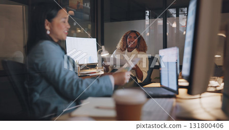 Business women, paperwork and web work at night with collaboration and working together in office. Communication, conversation and planning with internet report at desk at computer with online info Business women, paperwork and web work at night with collaboration and working together in office. Communication, conversation and planning with internet report at desk at computer with online info 131800406