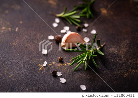 Rosemary, garlic, salt and pepper. 131800431