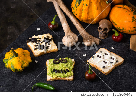 Halloween food for children, monsters toasts Halloween food for children, monsters toasts 131800442