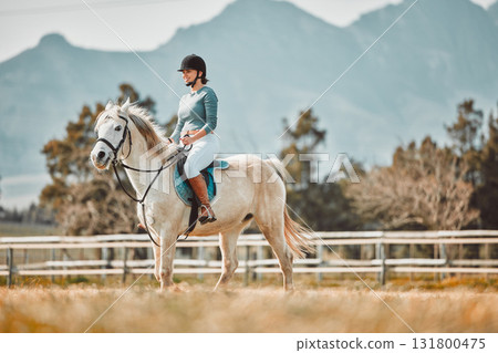 Horse riding, woman equestrian and countryside with mockup and person ready for farm training. Countryside, pet horses and outdoor sport with ranch animal in nature with mock up, mountains and grass Horse riding, woman equestrian and countryside with mockup and person ready for farm training. Countryside, pet horses and outdoor sport with ranch animal in nature with mock up, mountains and grass 131800475