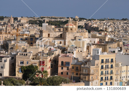 View of old building with windows, balconies in city. Republic of Malta, the picturesque city of Valetta, Malta. View of old building with windows, balconies in city. Republic of Malta, the picturesque city of Valetta, Malta. 131800689