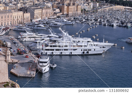 Drone view of Valletta city - many little yachts and boats at Valletta in Malta Drone view of Valletta city - many little yachts and boats at Valletta in Malta 131800692