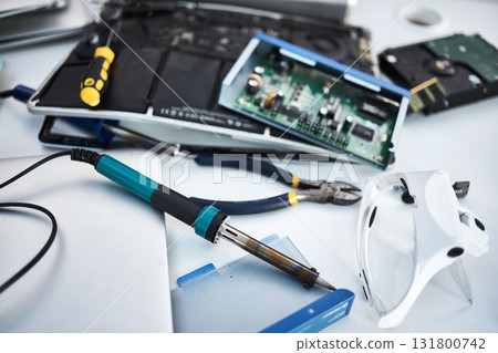 Tools, computer hardware and equipment in the office for tech repairs, maintenance or upgrade. Database, technology and supplies for electric board servers on a desk in the it industry workplace. 131800742