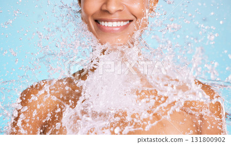 Water, splash and black woman cleaning her body for beauty, skincare and self care isolated in studio blue background. Portrait, model and young female washing skin for hygiene, aqua and hydration Water, splash and black woman cleaning her body for beauty, skincare and self care isolated in studio blue background. Portrait, model and young female washing skin for hygiene, aqua and hydration 131800902