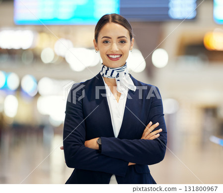 Woman, airport and passenger assistant with arms crossed standing ready with smile in FAQ, help or direction. Portrait of happy female airline service agent smiling for immigration or travel services Woman, airport and passenger assistant with arms crossed standing ready with smile in FAQ, help or direction. Portrait of happy female airline service agent smiling for immigration or travel services 131800967