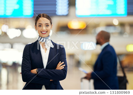 Woman, airport and service agent with arms crossed standing ready with smile in FAQ, help or direction. Portrait of happy female airline passenger assistant smiling for immigration or travel services Woman, airport and service agent with arms crossed standing ready with smile in FAQ, help or direction. Portrait of happy female airline passenger assistant smiling for immigration or travel services 131800969