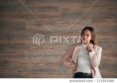 Thinking, business woman and studio idea for person contemplating plan, solution or problem solving ideas. Brainstorming entrepreneur, thoughtful and mockup entrepreneurship on wooden wall background 131801066