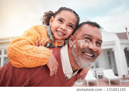 Smile, piggy back and grandfather with child in yard of house, happiness and security at family home. Relax, happy old man and girl bonding in backyard together with love and outdoor fun on weekend. Smile, piggy back and grandfather with child in yard of house, happiness and security at family home. Relax, happy old man and girl bonding in backyard together with love and outdoor fun on weekend. 131801185
