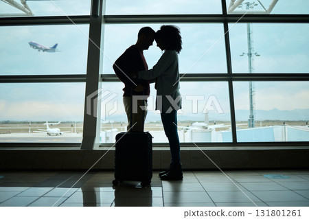 Airport, couple and silhouette of love, hug and leaving on vacation on a airplane flight. Plane departure, holiday and young people shadow by a window for journey, vacation break or immigration 131801261