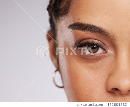 Eye, vision and beauty with contact lens and black woman, care for eyes and cosmetics with closeup on studio background. Microblading, eyebrow and lashes, face and skin in portrait with mockup space Eye, vision and beauty with contact lens and black woman, care for eyes and cosmetics with closeup on studio background. Microblading, eyebrow and lashes, face and skin in portrait with mockup space 131801282