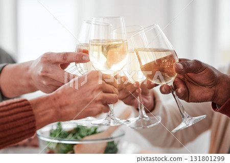 Hands, dinner and party with wine glass and cheers together with love and drinks with celebration and holiday. Toast, alcohol beverage and relationship, hungry people with meal and social event 131801299