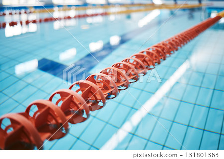 Water, empty swimming pool and lanes for competition, exercise and workout. Sports, swim and fitness with lane ropes or divider in liquid for aquatic training, exercising or underwater practice. 131801363