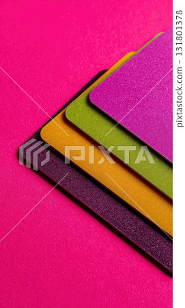Colorful credit card plastic pink green yellow purple close up vibrant isolated Colorful credit card plastic pink green yellow purple close up vibrant isolated 131801378