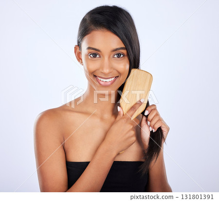 Woman, portrait smile and brush for grooming, haircare salon or keratin treatment against a white studio background. Happy isolated female beauty model smiling and brushing straight long hairstyle Woman, portrait smile and brush for grooming, haircare salon or keratin treatment against a white studio background. Happy isolated female beauty model smiling and brushing straight long hairstyle 131801391