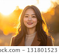 Smiling woman with sunset in the background 131801523