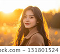 Autumn woman illuminated by the setting sun 131801524