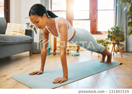 Home fitness, push up or woman in yoga for body flexibility, holistic wellness or healthy lifestyle. Living room, plank or zen girl in warm up exercise, workout or training in house exercising studio Home fitness, push up or woman in yoga for body flexibility, holistic wellness or healthy lifestyle. Living room, plank or zen girl in warm up exercise, workout or training in house exercising studio 131801529