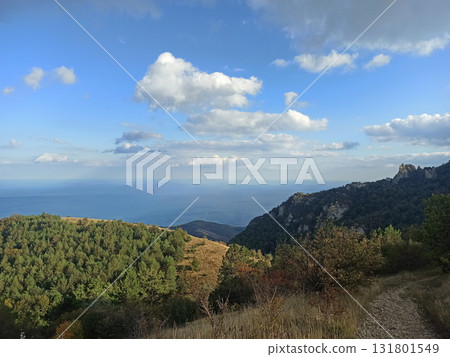 beautiful green mountain landscape with clouds upper them. autumn time. Crimea beautiful green mountain landscape with clouds upper them. autumn time. Crimea 131801549