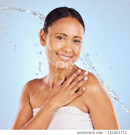 Senior woman, water splash and beauty portrait, hygiene and sustainable skincare for antiaging on blue background. Hand, clean and female smile, eco friendly dermatology and cosmetic care in studio Senior woman, water splash and beauty portrait, hygiene and sustainable skincare for antiaging on blue background. Hand, clean and female smile, eco friendly dermatology and cosmetic care in studio 131801751