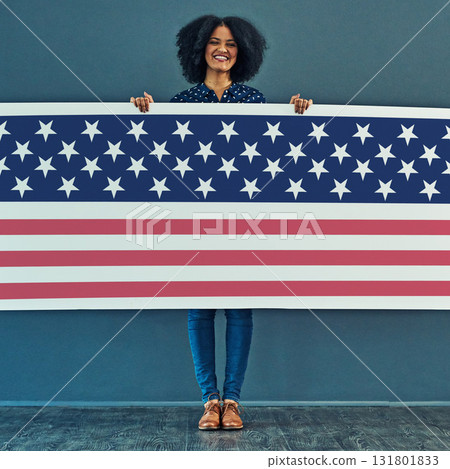 Portrait, American flag and woman with smile, patriotic and pride for country against a wall. Face, female and person with USA symbol, confidence and motivation for freedom, human rights or happiness 131801833