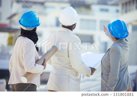 Engineering, collaboration or team on construction site with an blueprint for real estate development. Industrial, architecture or back view of group planning a building renovation project in meeting Engineering, collaboration or team on construction site with an blueprint for real estate development. Industrial, architecture or back view of group planning a building renovation project in meeting 131801881