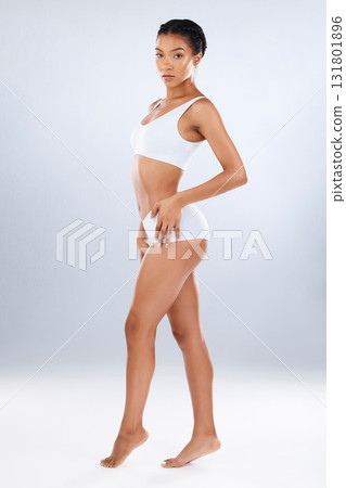 Health, wellness and body care, portrait of woman in underwear with healthy diet, exercise and balance in studio. Fitness, nutrition and healthcare, beauty slim fit figure isolated on grey background Health, wellness and body care, portrait of woman in underwear with healthy diet, exercise and balance in studio. Fitness, nutrition and healthcare, beauty slim fit figure isolated on grey background 131801896