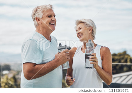 Senior couple, fitness and water bottle with smile for hydration or thirst after workout, exercise or training in nature. Happy elderly man and woman smiling for natural refreshment from exercising Senior couple, fitness and water bottle with smile for hydration or thirst after workout, exercise or training in nature. Happy elderly man and woman smiling for natural refreshment from exercising 131801971