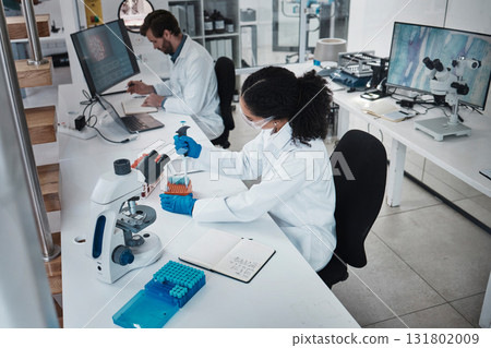Technology, teamwork or collaboration in laboratory research, dropper test or dna science engineering in top view. Black woman, man or scientist in medical study, sample pipette or pharmacy medicine Technology, teamwork or collaboration in laboratory research, dropper test or dna science engineering in top view. Black woman, man or scientist in medical study, sample pipette or pharmacy medicine 131802009