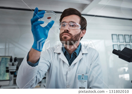 Science, blood and sample with a doctor man at work in a laboratory for analysis or research. Medical, innovation and dna with a male scientist working in a lab for development or breakthrough 131802010